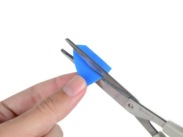 Image 2/3: And, in keeping with the tradition of [https://www.ifixit.com/Teardown/Apple+Watch+Teardown/40655#s93658|last-minute tool modifications,|new_window=true] we make use of our all new Apple Watch Opening Pick to lift the System in Package out of the rear enclosure.