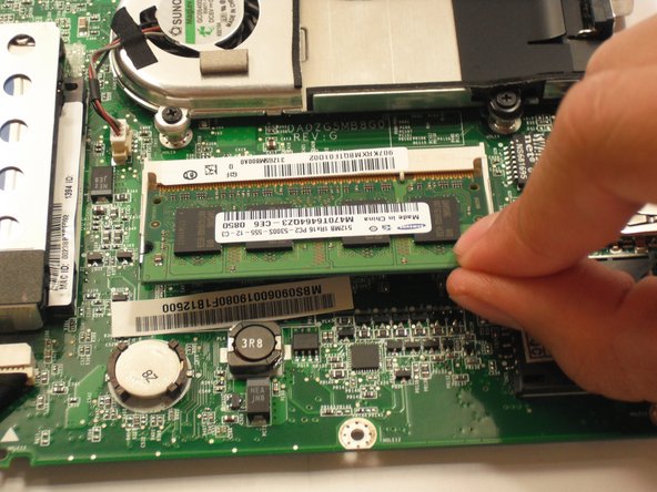 Pull RAM straight out from the slot.