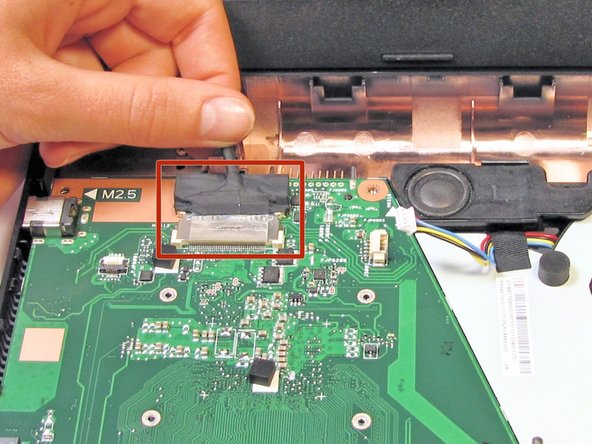 Gently lift any tape that may be holding the connection.