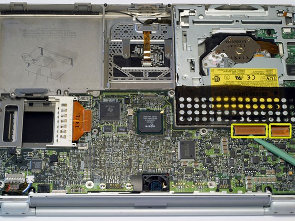 Image 1/1: Disconnect both orange ribbon cables from the logic board using a spudger or the tip of your finger.