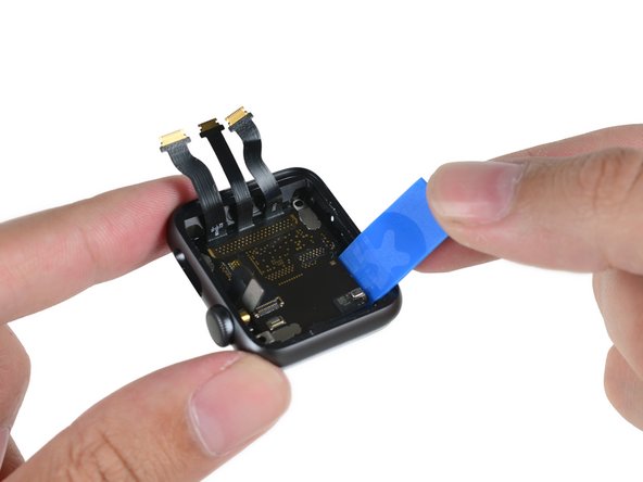 Image 3/3: And, in keeping with the tradition of [https://www.ifixit.com/Teardown/Apple+Watch+Teardown/40655#s93658|last-minute tool modifications,|new_window=true] we make use of our all new Apple Watch Opening Pick to lift the System in Package out of the rear enclosure.