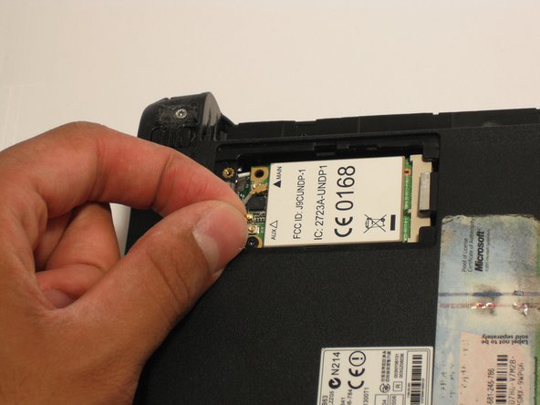 Disconnect the two antenna cables from the left side of the wireless card.