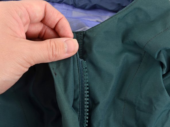 What are the steps to repair a zipper when its slider has come off?