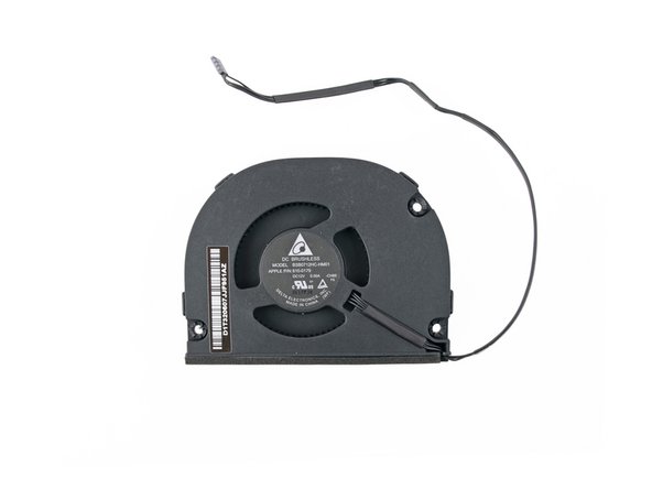 Image 2/3: We quickly blow off the fan in favor of peeking under the metal casing.