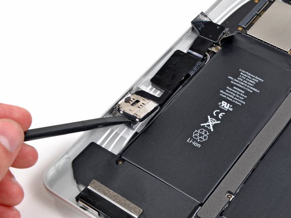 Image 1/3: It sure  doesn't look like Apple was tight on space. As far as we know, the only purpose of this board is to connect the SIM card to the logic board.