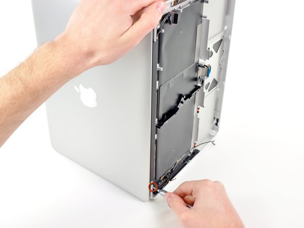 Image 1/1: Place your opened MacBook Pro on a table as pictured.