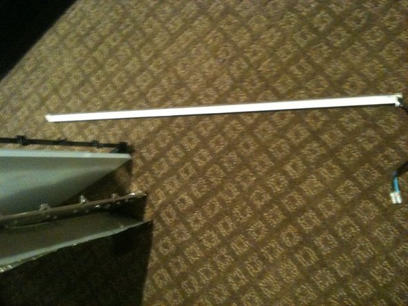 Image 3/3: The top CCFL tube can be seen and '''CAREFULLY''' removed