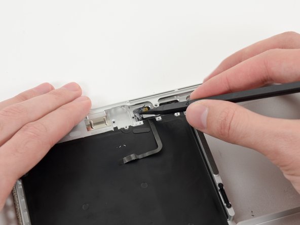 Image 1/3: Grasp the piece of tape with a pair of tweezers and remove it.