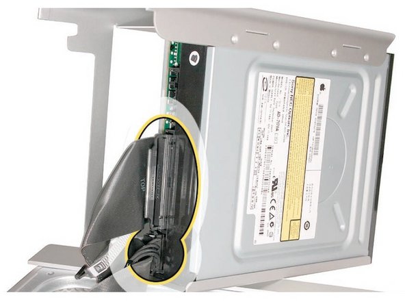 Image 3/3: Disconnect the power and ribbon cables from the optical drive(s) and remove the carrier.