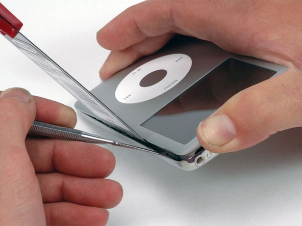 Gently begin to disengage the clip from the front panel.