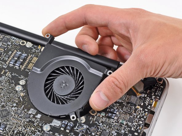 Image 2/2: Remove the left fan from the upper case, minding its cable that may get caught.