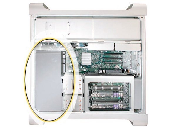 Image 1/3: Remove the second Phillips screw at the bottom front of the assembly.