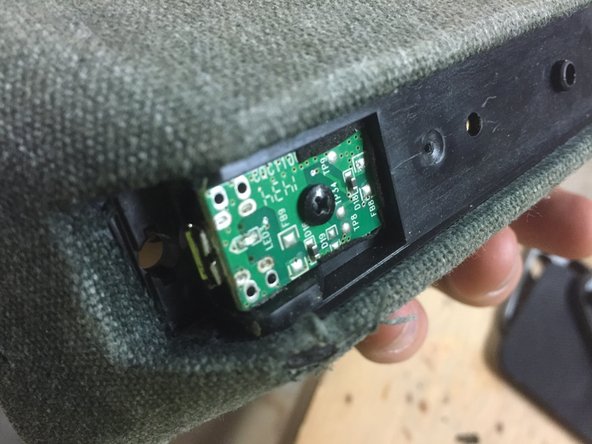 With the wooden backplate gone, you can now unscrew the small circuit board holding the micro usb socket.