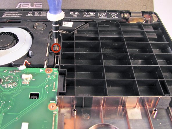 Using the Phillips #0 Screwdriver, unscrew the 5.5 mm Phillips #0 screw that holds the spacer in place.