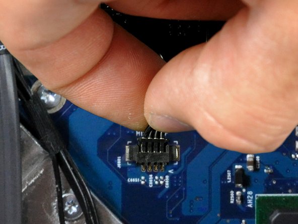 Image 2/3: Pull this connector parallel to the face of the logic board toward the top edge of the iMac.