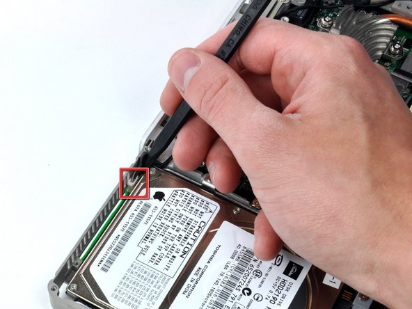 Image 1/1: The cable you're about to remove is very fragile - do not pull directly on the wires. Instead, try to pry up the connector directly, using a spudger or a small flathead screwdriver if necessary.