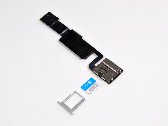 Image 3/3: It sure  doesn't look like Apple was tight on space. As far as we know, the only purpose of this board is to connect the SIM card to the logic board.