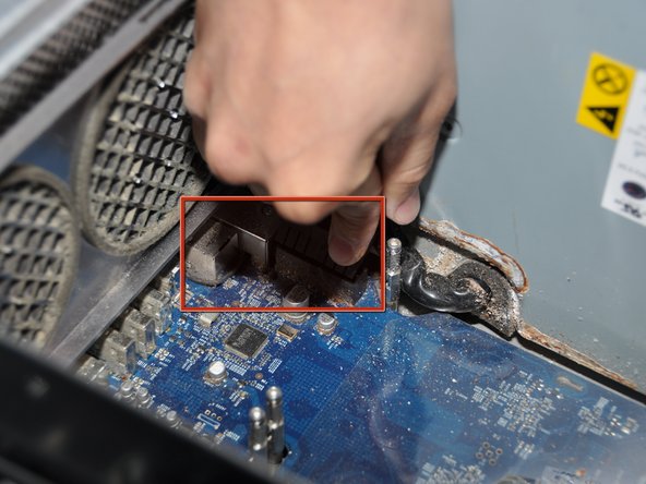 Image 2/3: Unplug the cord that is located below where the cooling unit was. To do this, pull outwards.