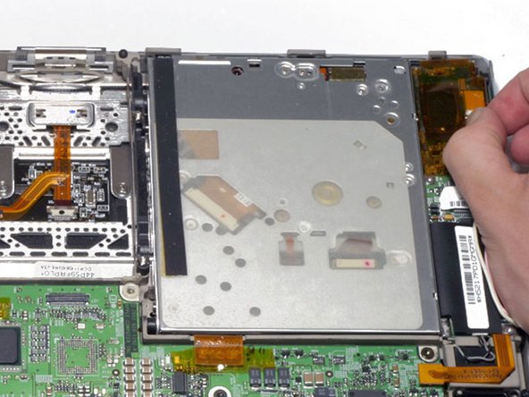 Image 1/1: The display inverter has orange plastic shielding around it that looks similar to the tape used elsewhere within the computer. Do not remove the shielding from the inverter.