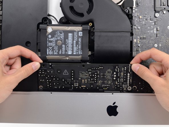 Image 1/2: Tilt the power supply forward.