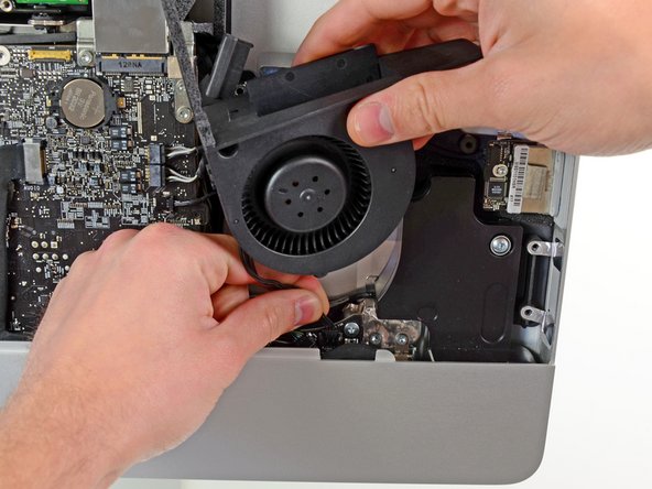 Image 1/1: Remove the optical drive fan from the iMac.