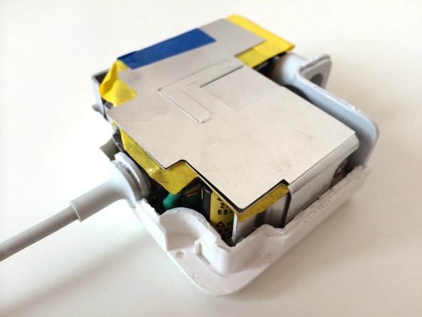 Image 1/3: Put the 4 pieces of the wire holder assembly back into place.