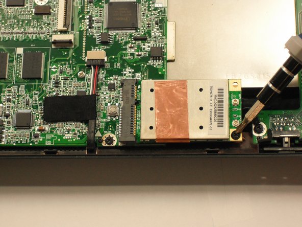 Remove the single 3.9 mm Phillips #1 screw from the wireless card.