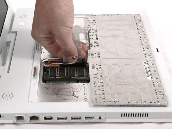 Image 1/1: Make sure that you reconnect the keyboard cable before replacing the RAM shield.