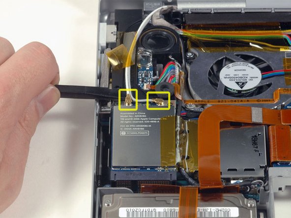 Image 1/1: The white antenna cable connects to the left side of the Airport Extreme card.
