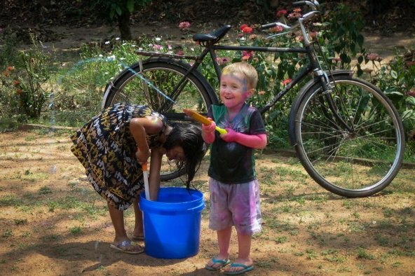 David Kraemer's son having a waterfight in India