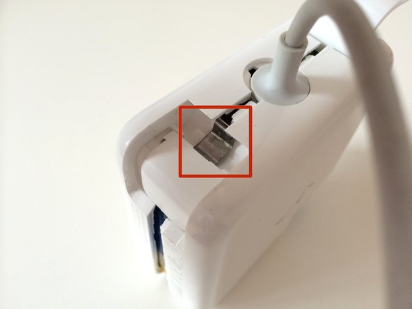 Image 2/3: Make sure the metal part goes UNDER the case, like so.