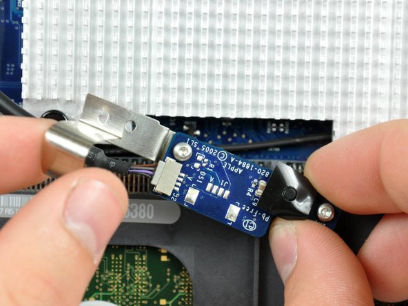 Image 2/2: Remove the IR cable finger and move the IR board, with cable still attached, out of the way.