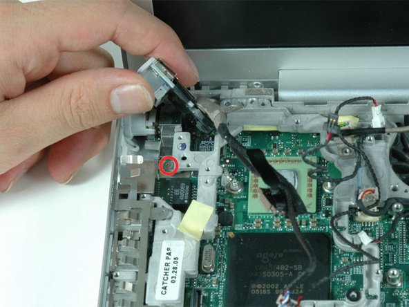Image 1/1: You may have to remove the metal shield above the RJ-11 board before you can lift it up.