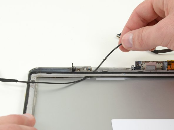 Image 1/1: Remove the AirPort/iSight cable from the display assembly.