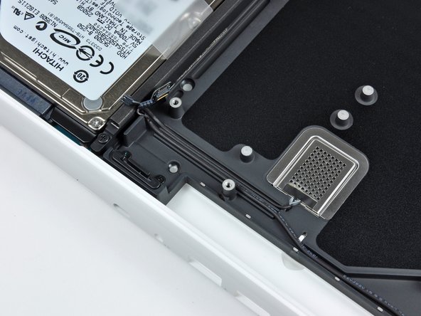 Image 3/3: The MagSafe board may get accidentally disconnected during this process. As a precaution, be sure the MagSafe board connector is securely seated in its socket before lowering the logic board back into the upper case.
