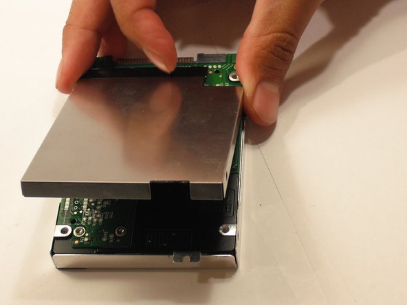 Remove the upper and lower casing from the hard drive.