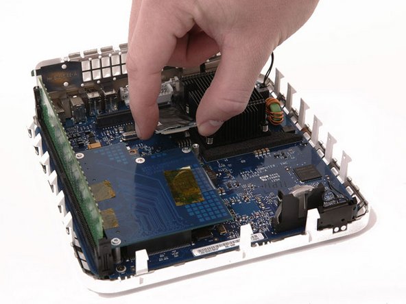 Pull the modem up from its connector. If it sticks, just wiggle it back and forth a bit as you pull up.