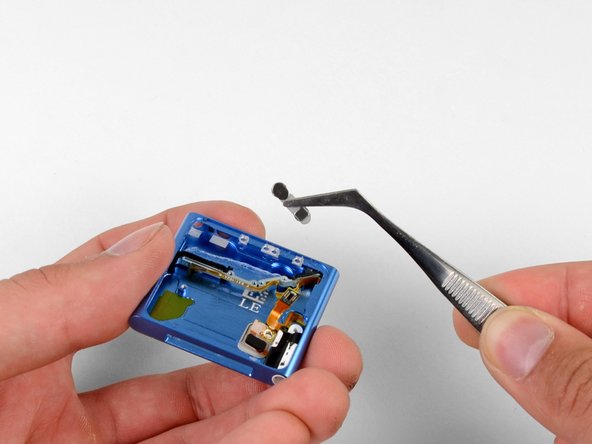 With the assembly away from the case, the volume buttons are free for removal.