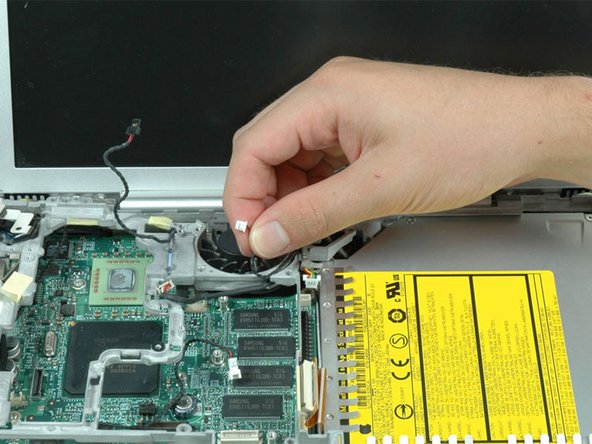 Image 1/1: The metal framework should now be free can be removed from the computer. Be careful when removing the metal framework that none of the cables get caught on the framework.