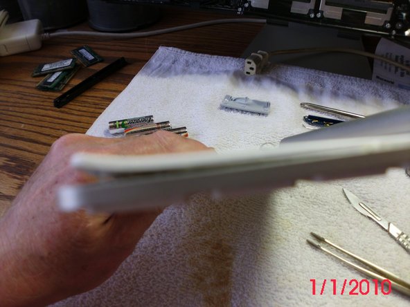 Image 2/3: Glue is all over the bottom plate.  It was separated by pulling it apart and slicing the glue with a scalpel.