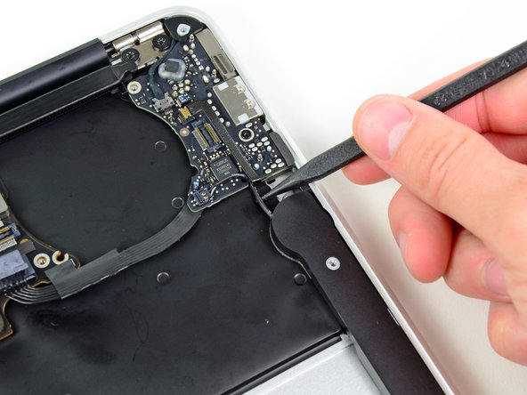 Image 1/2: Pry up from beneath the wires.