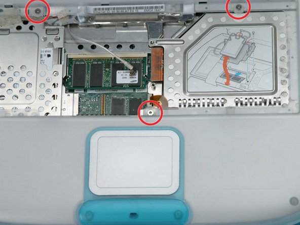 Image 1/1: Remove the three Phillips screws.