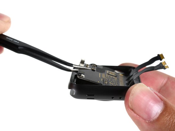 Image 1/3: On the top of the SiP,  tucked into the upper left corner, we spot a tiny pair of components: