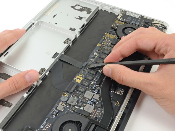 Image 2/2: Be sure you are prying up on the hinged retaining flap, '''not''' the socket itself.