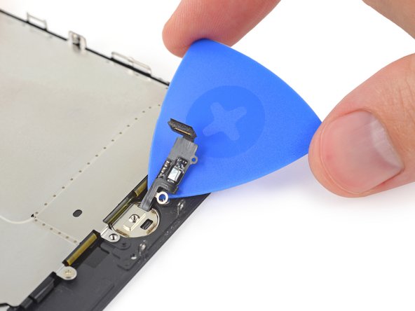 Use an opening pick to gently separate the adhesive holding the home/Touch ID sensor cable to the back side of the display panel.