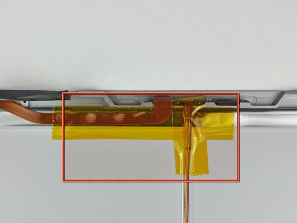 Image 1/1: Hold the camera cable down while removing the tape.