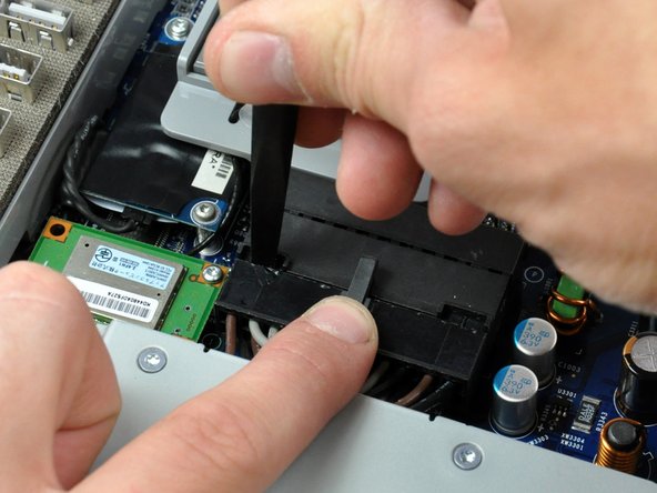 Image 2/3: It will be necessary to work from alternate sides until the connector is free.