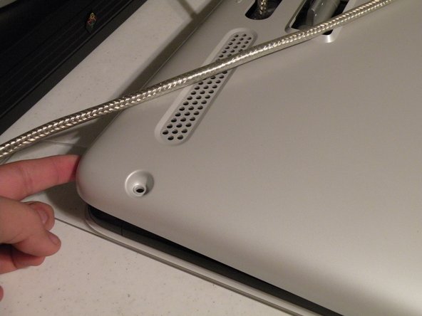 Image 1/3: Grasp the bottom of the 2nd panel and lift it up, route the ADB cable through the hole.