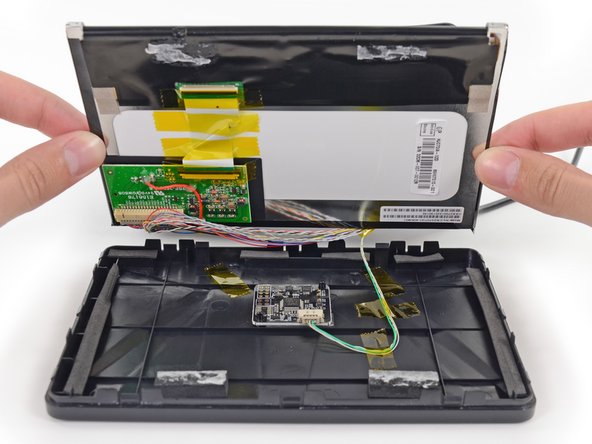 Image 2/3: Disconnecting one cable from the display assembly allows us to completely remove it for further examination.