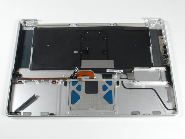 Image 1/1: This case assembly includes the keyboard, glass trackpad, and ribbon cables.